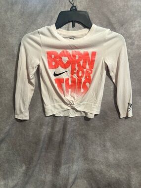Nike White Long-Sleeve Twist Tee with Bright Orange Graphic